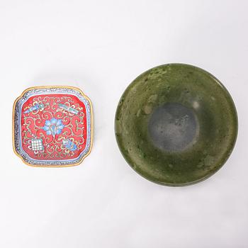A Chinese enamel on copper coaster, a green stone bowl and a small stone figure, China, Qing dynasty and 20th century.