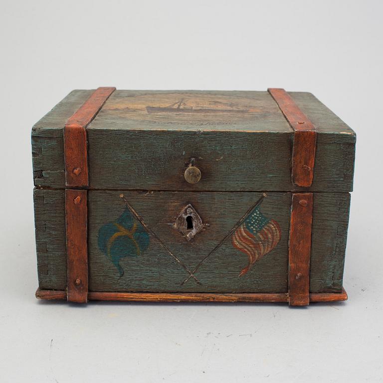 A painted box with motif from the Swedish American Line early 20th century.