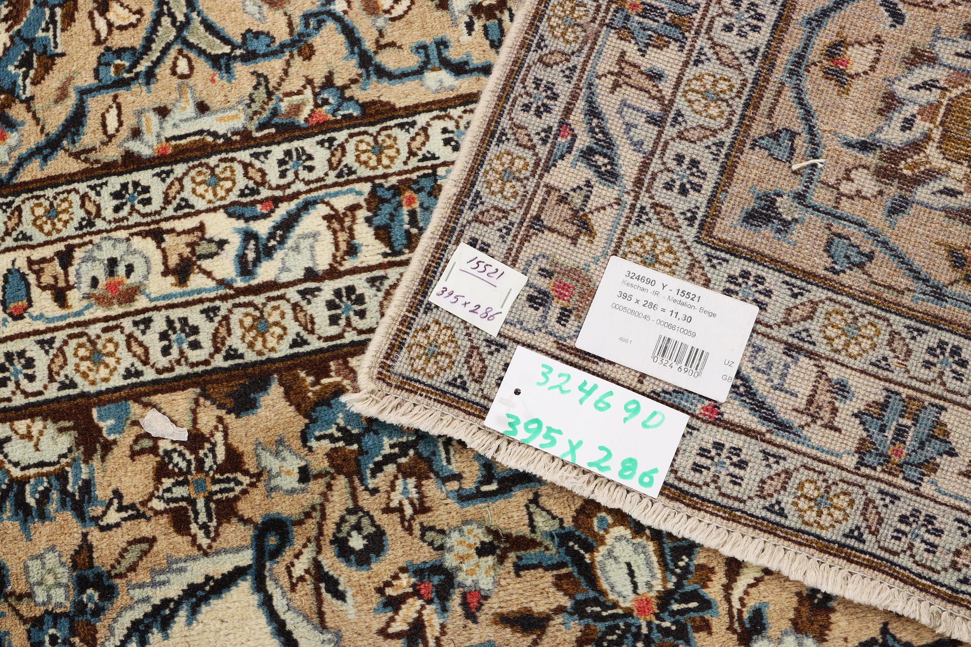 A Keshan carpet, a. 395 x 286 cm.