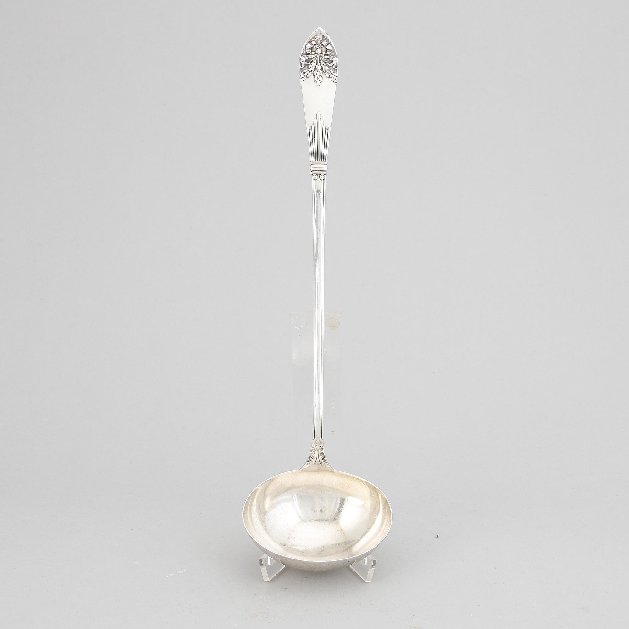 A Swedish silver "Empire" soup ladle, maker's mark Carl Winnerstrand, Stockholm, 1908.