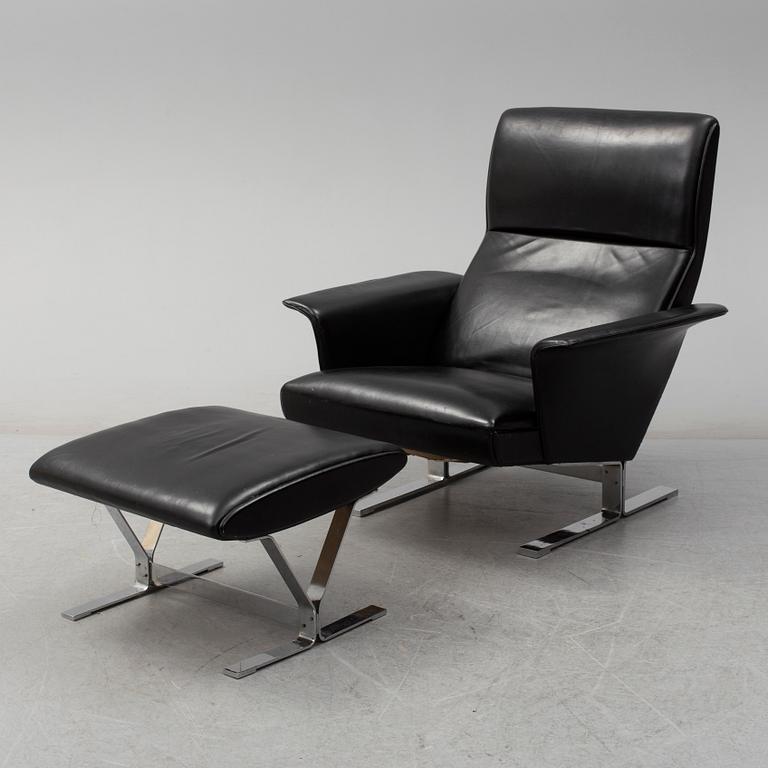 A second half of the 20th century easy chair and stool by Georg Thams, Vejens Polstermöbelfabrik, Denmark.