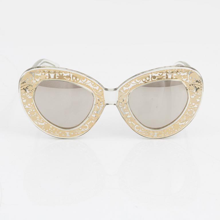 Karen Walker, a pair of "Intergalactic" sunglasses.