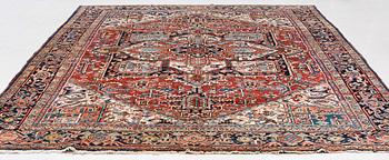A semi-antique Heris carpet, c. 364 x 299 cm.