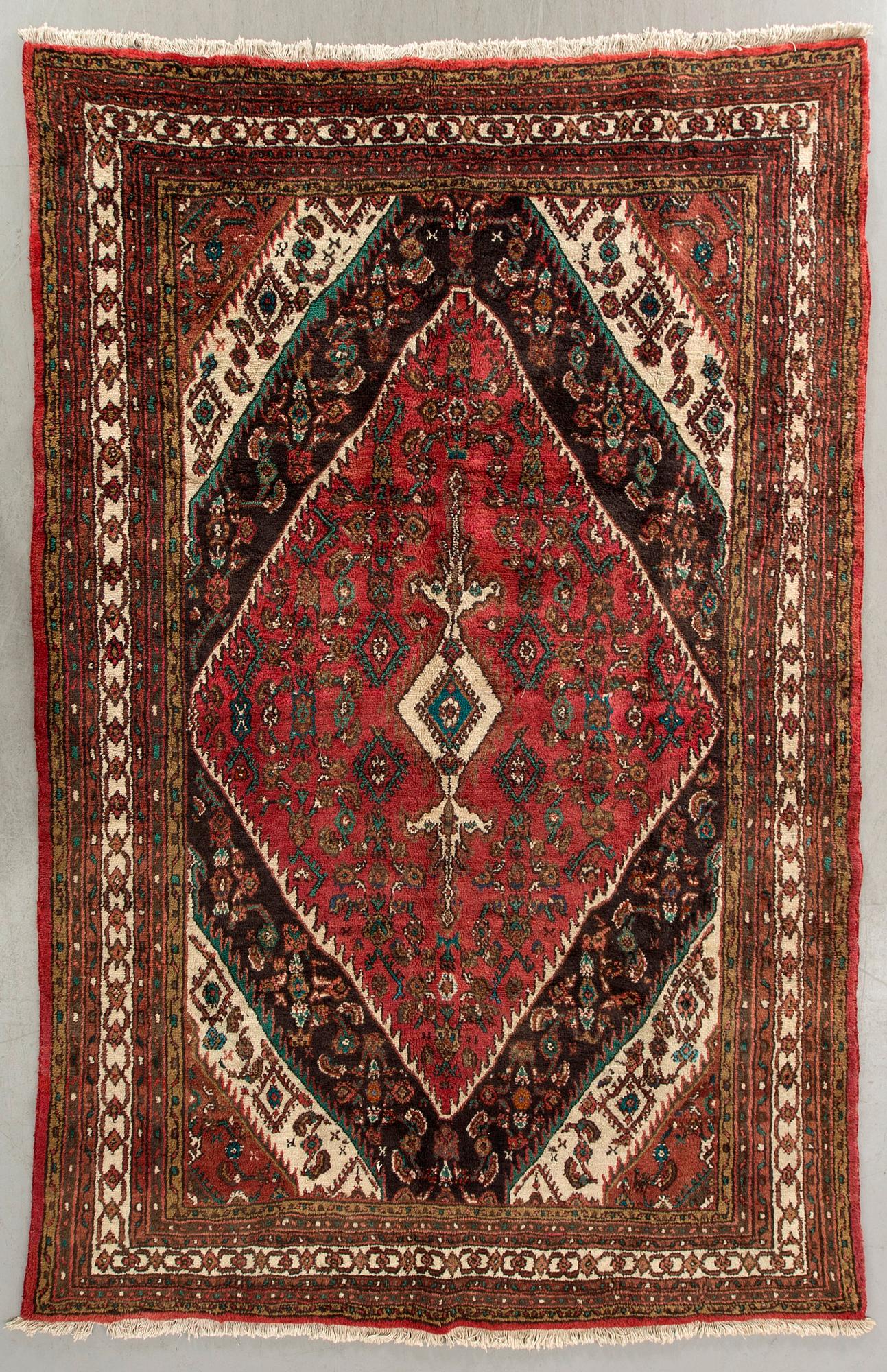 An old Dargazin carpet ca 303 x 205 cm.