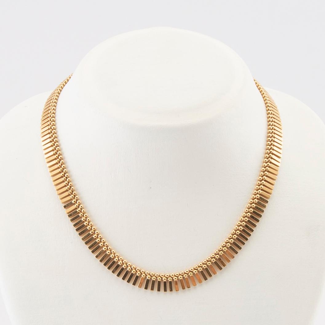An 18K gold necklace by Unoaerre Italy.