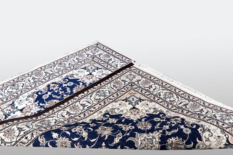 A rug, Nain, ca 210 x 122 cm.