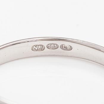 A 14K white gold ring with sapphires.