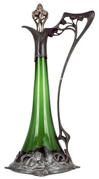705. An Art Noveau WMF claret jug in green glass and plated with "Old Silver" mounts, ca 1906.