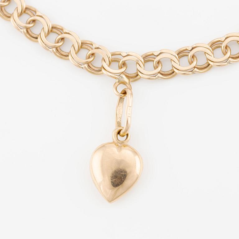 Bracelet, 18K gold with charms.