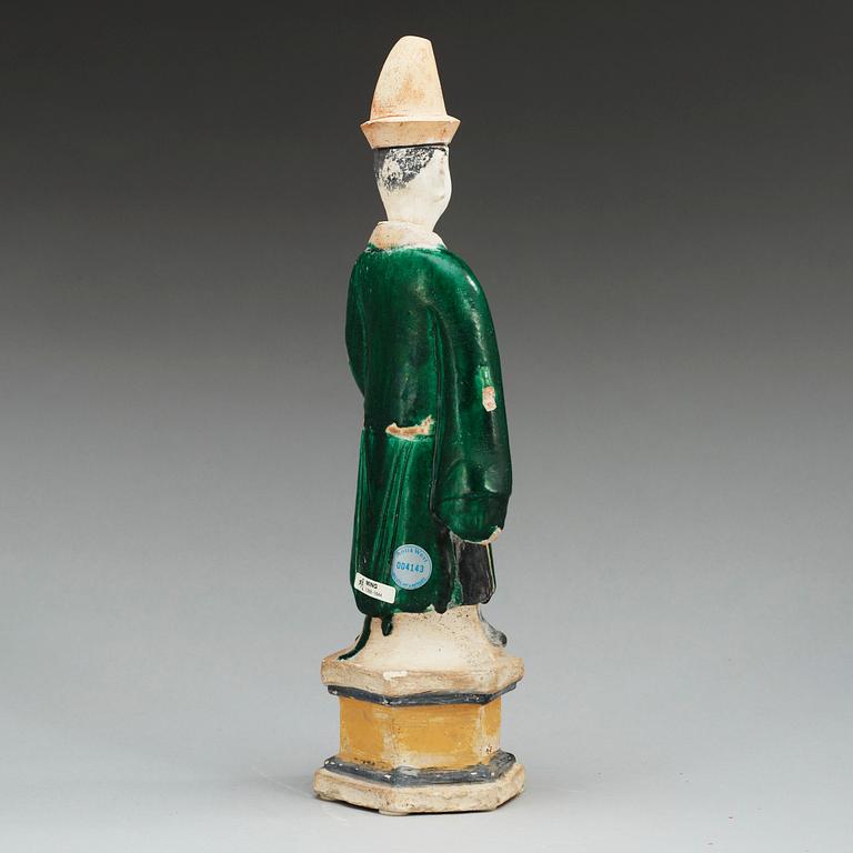 A green and yellow glazed potted figure of a Dignitary, Ming dynasty (1368-1644).