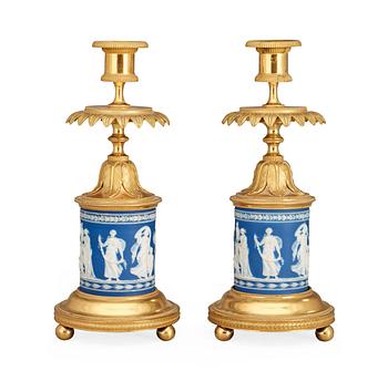 766. A pair of Victorian Wedgewood and gilt bronze candlesticks.