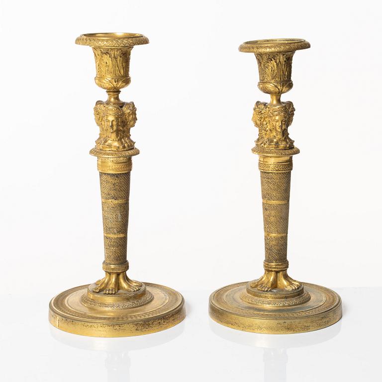 A matched pair of candlesticks, Empire, France, first half of the 20th century.