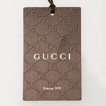 A pair of Gucci ladies' leather gloves.