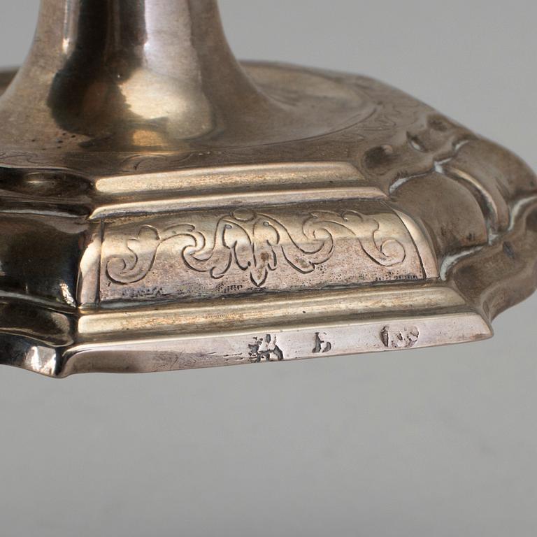 A pair of 18h century silver candlesticks, unidentified marks.