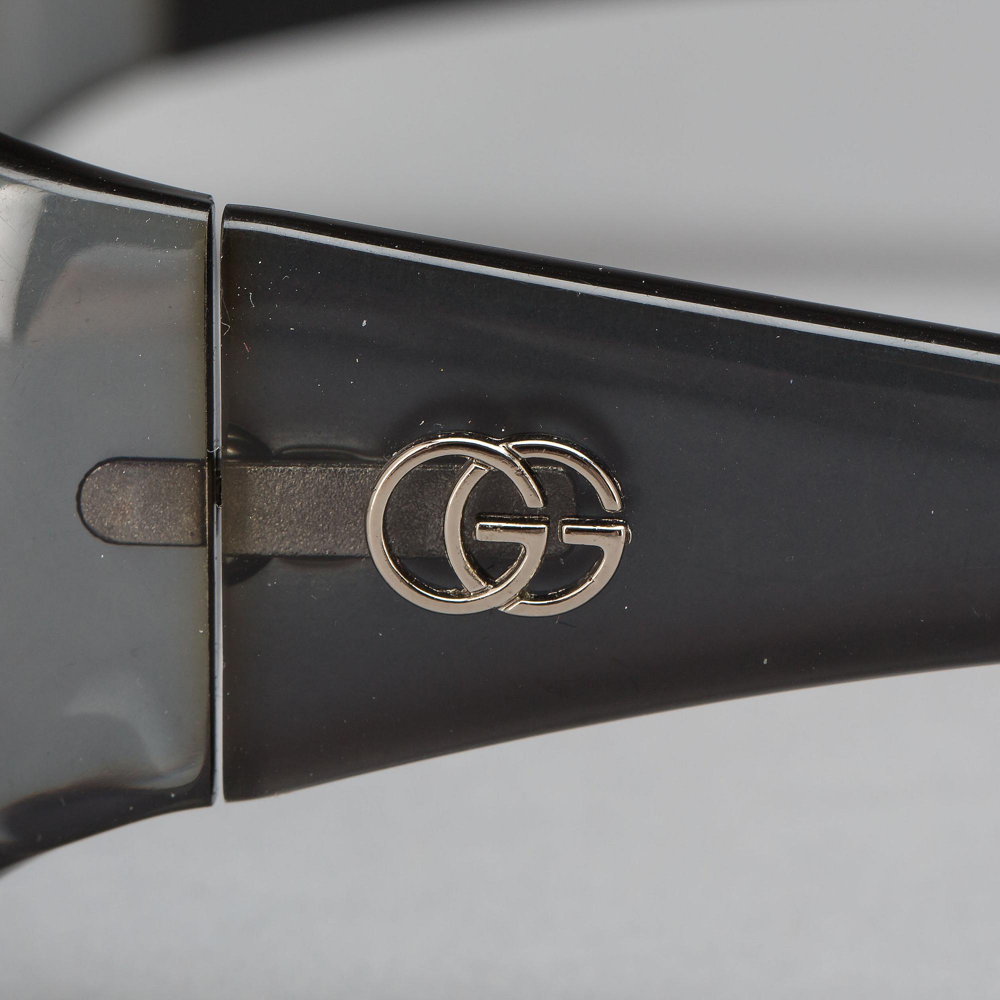 AURINKOLASIT, Gucci.