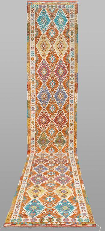 A Kilim runner, classic design, approximately 771 x 127 cm.