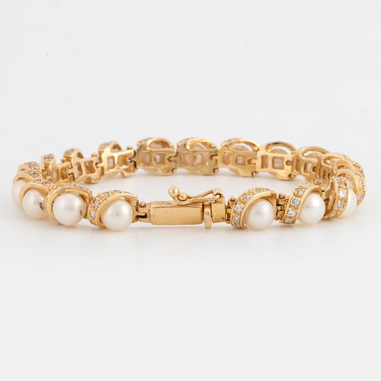 ARMBAND 14K guld, diamanter och pärlor.