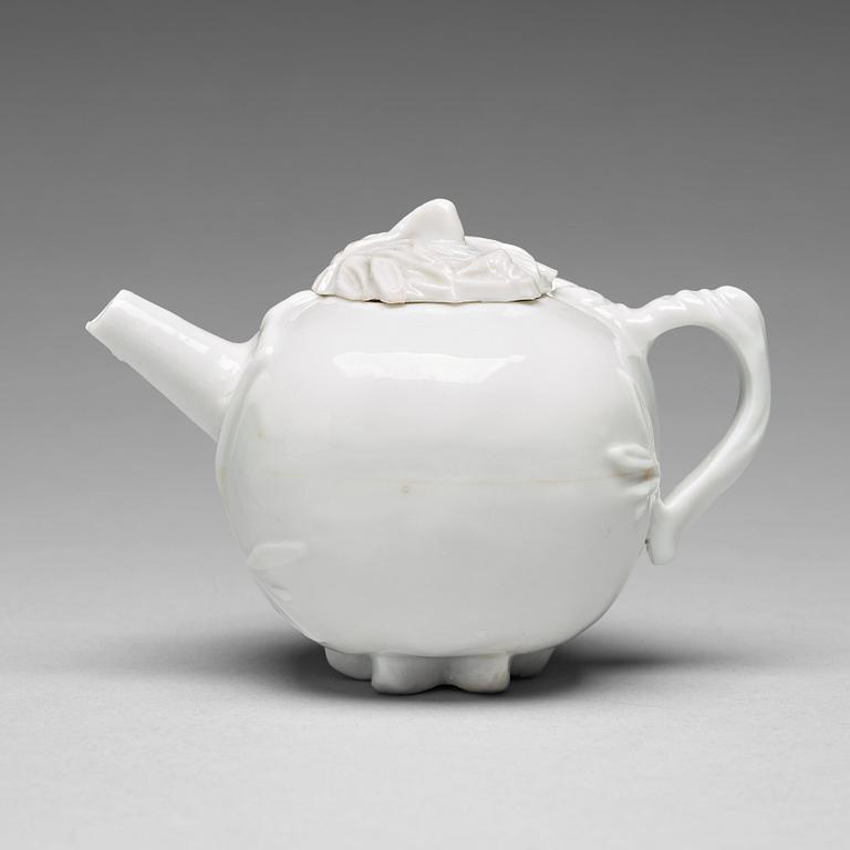 A pomegranate-shaped blanc de chine teapot with cover, Qing dynasty, Kangxi (1662-1722).