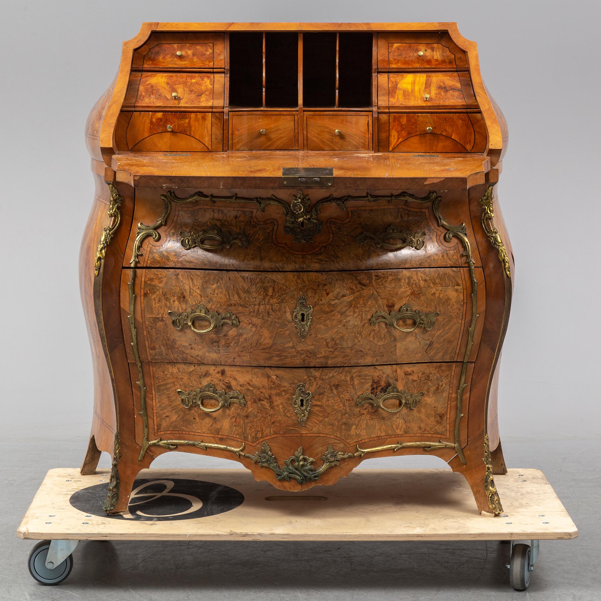 A 19th century rococo style secretaire.