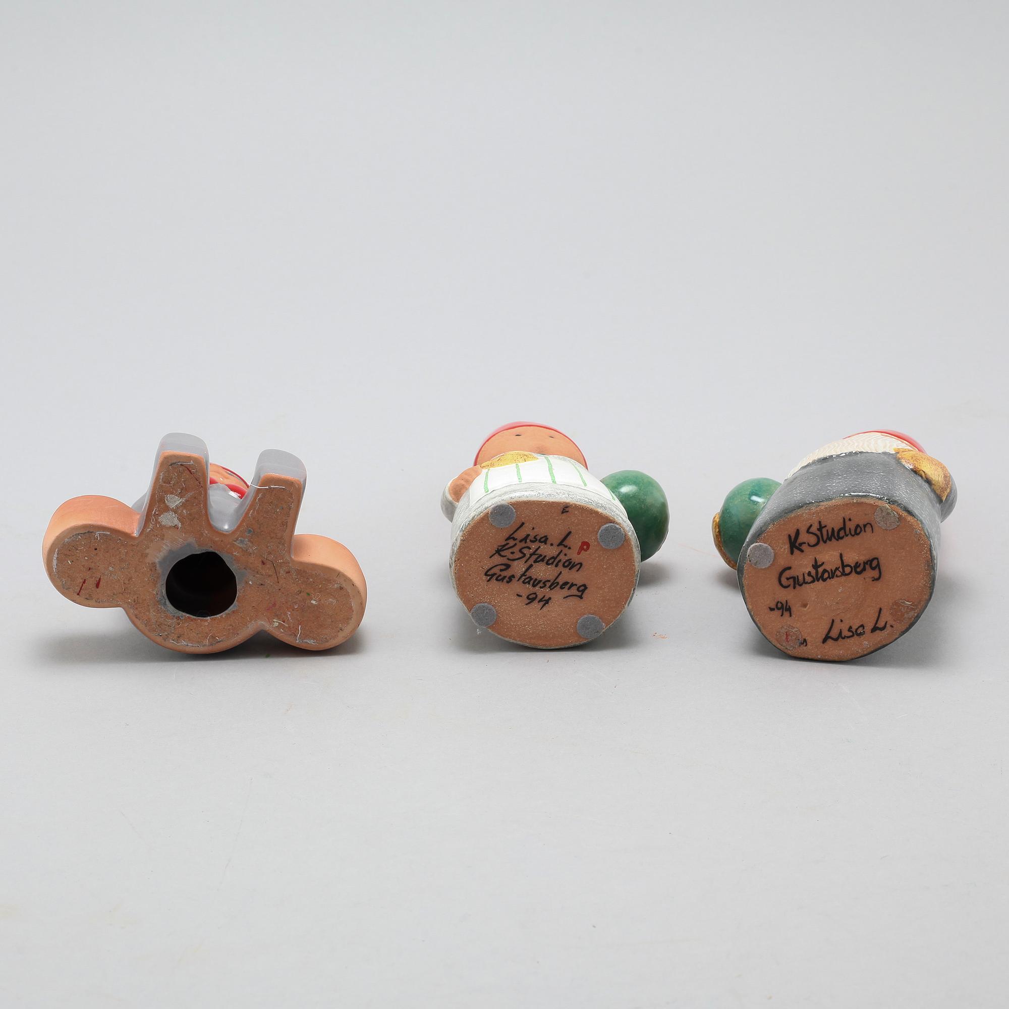 Three ceramic candlesticks by Lisa Larson for Gustavsberg, partly signed.