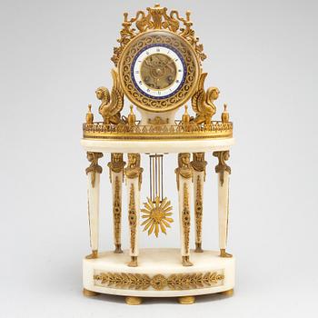 A French late 19th or early 20th century Empire style pendulum clock.