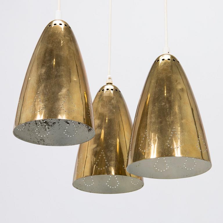 A mid-20th-century brass pendant ceiling light.