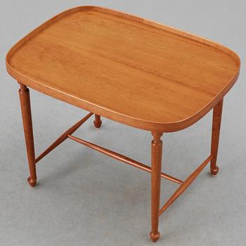 A Josef Frank mahogany table by Svenskt Tenn.