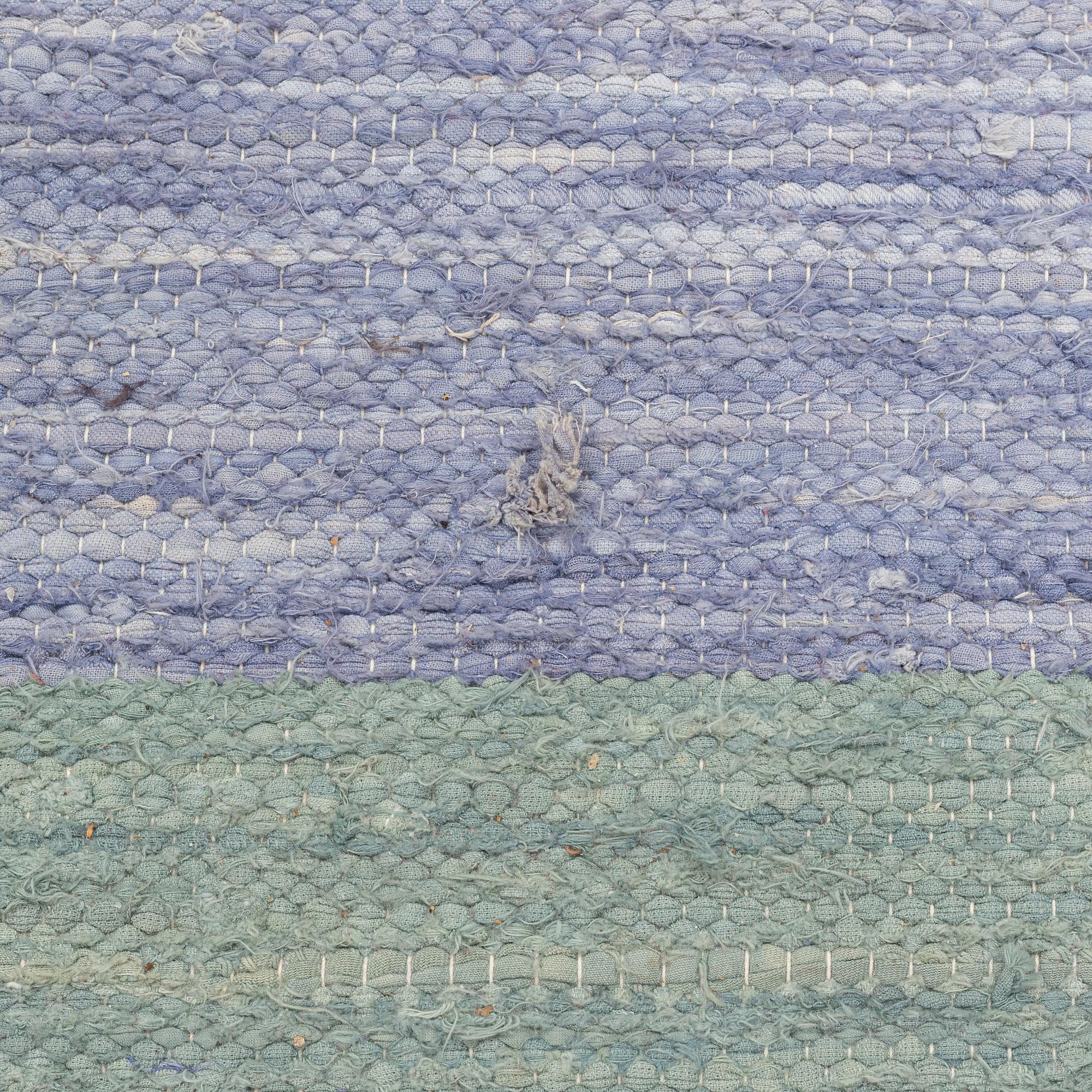 A rag rug, c. 300 x 195 cm.