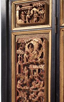 A set of four framed wooden panels, Qing dynasty, 19th Century.