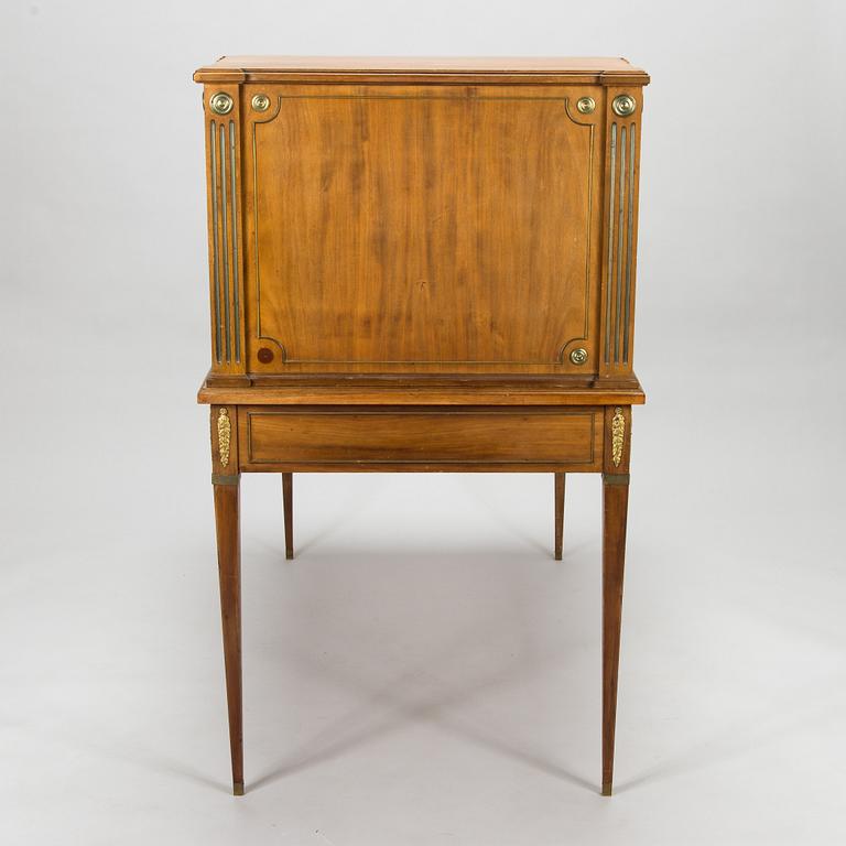 A 20th-century Louis XVI style mahogany veneered writing desk.