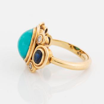 An 18K gold and turquoise Grima ring set with faceted sapphires and round brilliant-cut diamonds.