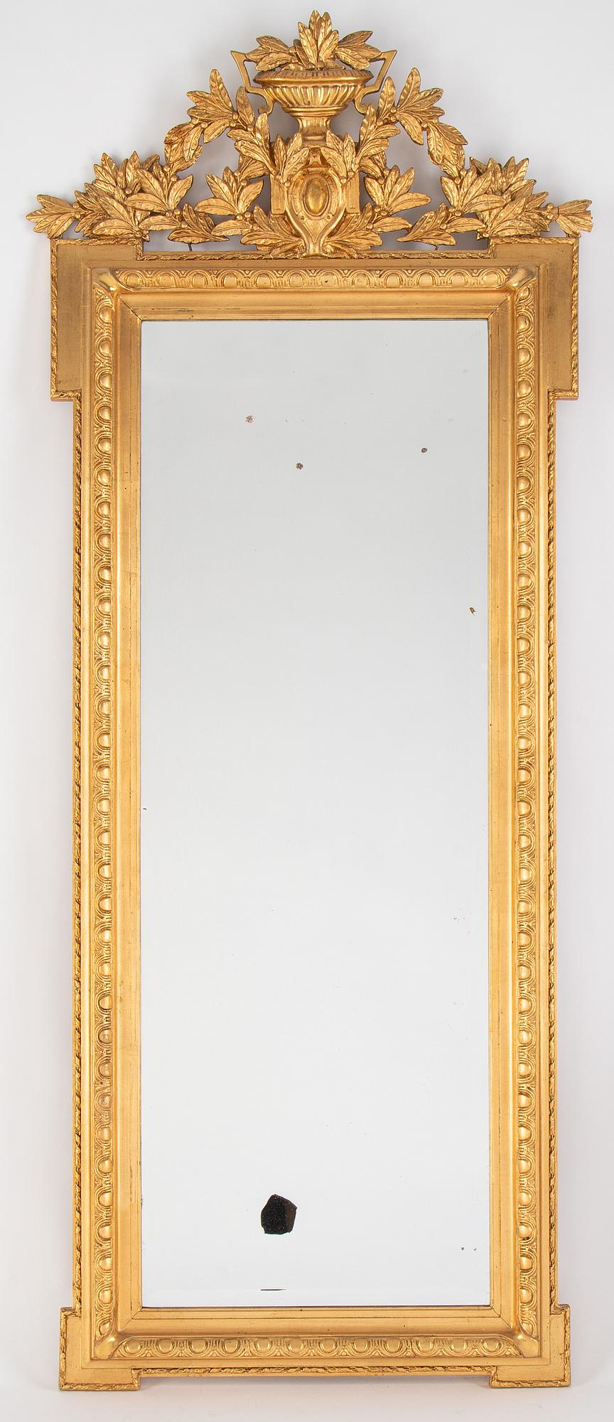 A mirror and console table from around the year 1900.