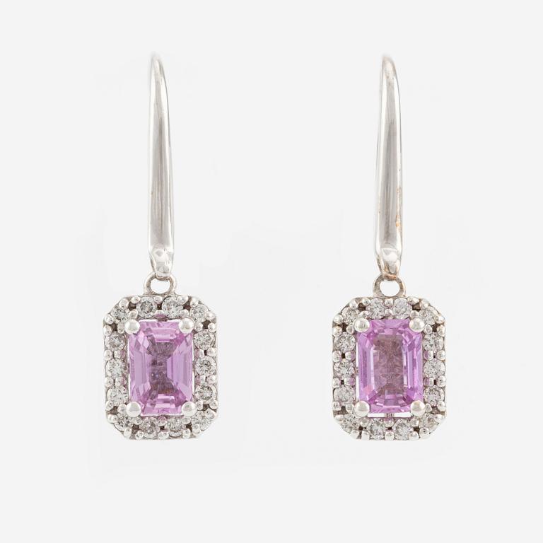 A pair of earrings in 18K white gold with pink sapphires and round brilliant-cut diamonds.