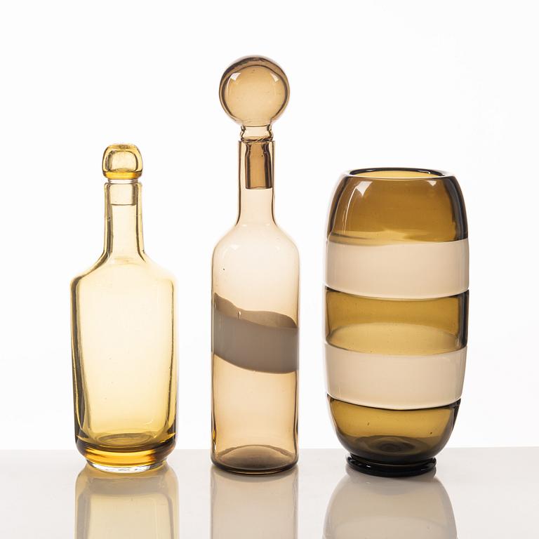 A glass vase and two bottles, including Archimede Seguso and Venini, Murano, Italy.