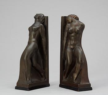 A pair of Axel Gute patinated bronze bookends, Sweden 1920's.