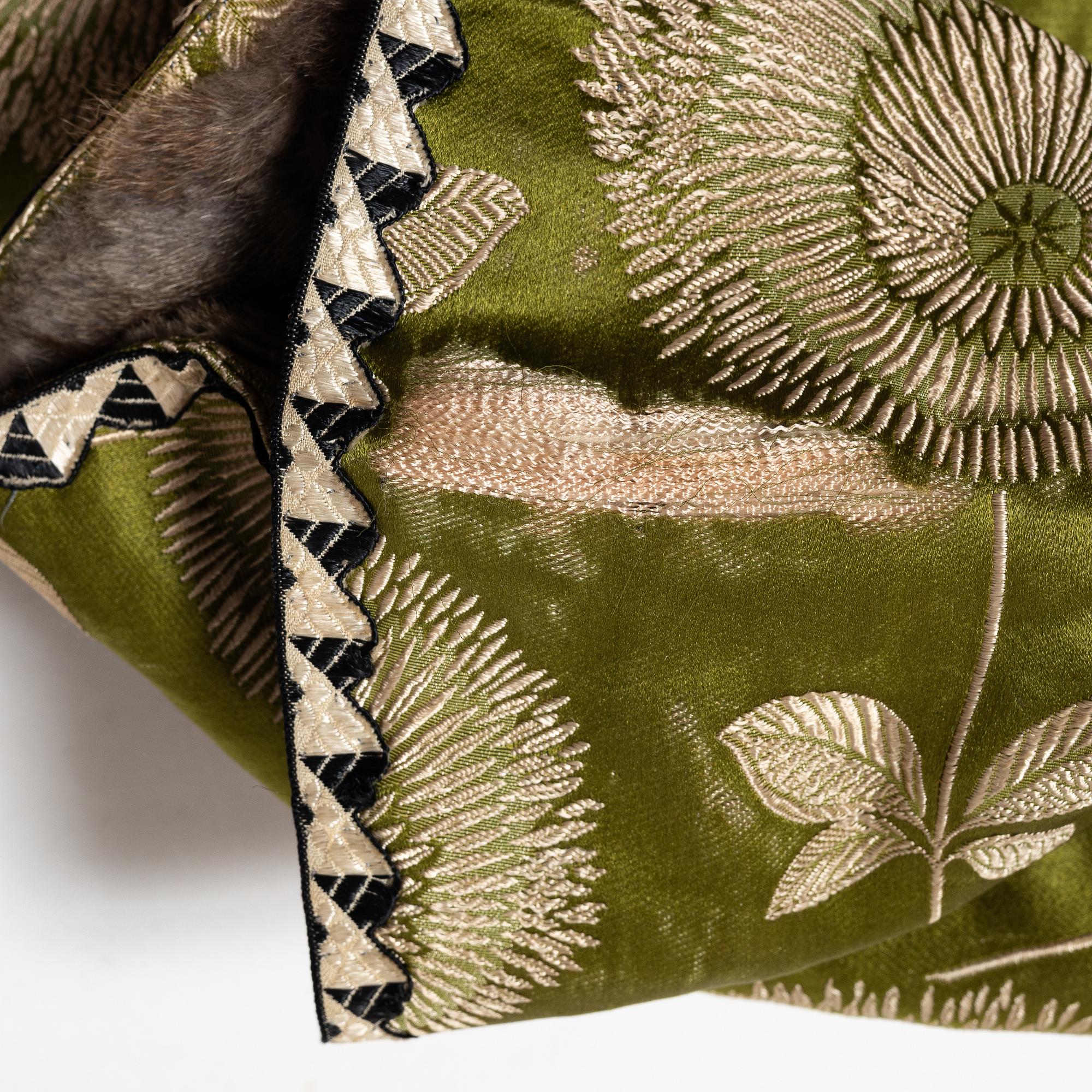 A Japanese silk brocade and fur childrens jacket, Meiji (1868-1912).