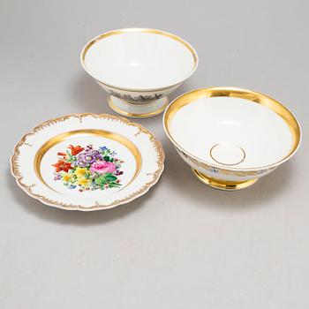 A set of three odd Berlin serving dishes, a set of two bowls and a dish and a figurine, 19th and 20th Century.