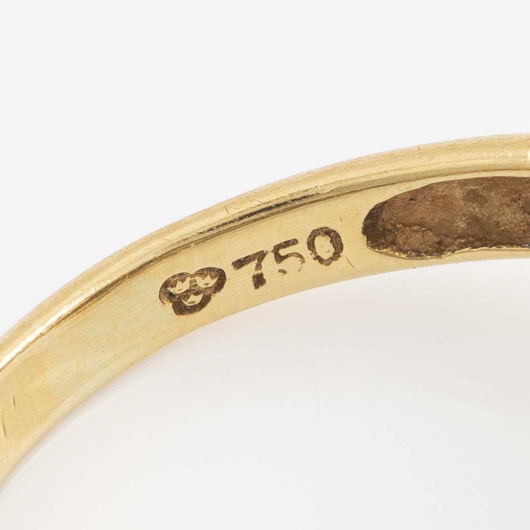 Ring, in the form of a panther, 18K gold with diamonds, sapphires, rubies, and emeralds.