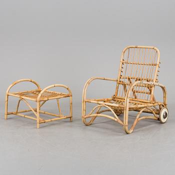 AN EASY CHAIR AND STOOL, 1950s/60s.