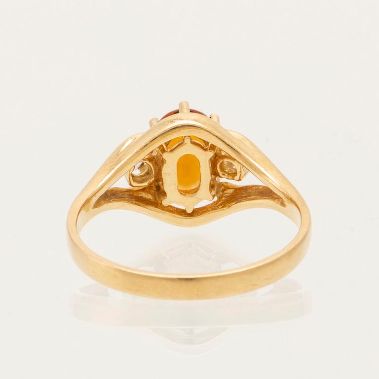 H.Stern ring in 18K gold with an oval faceted citrine and round brilliant-cut diamonds.