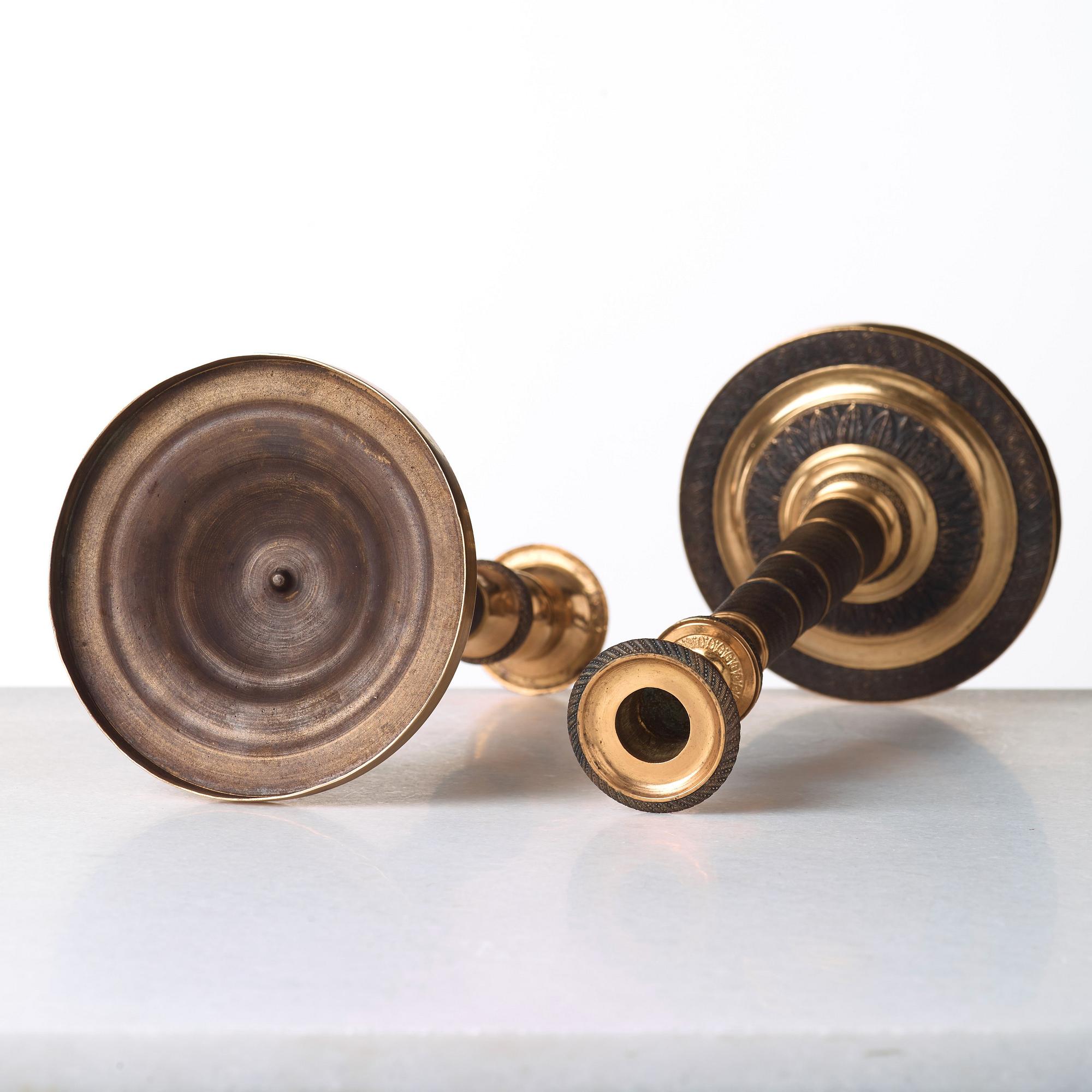 A pair of French Empire early 19th century candlesticks.