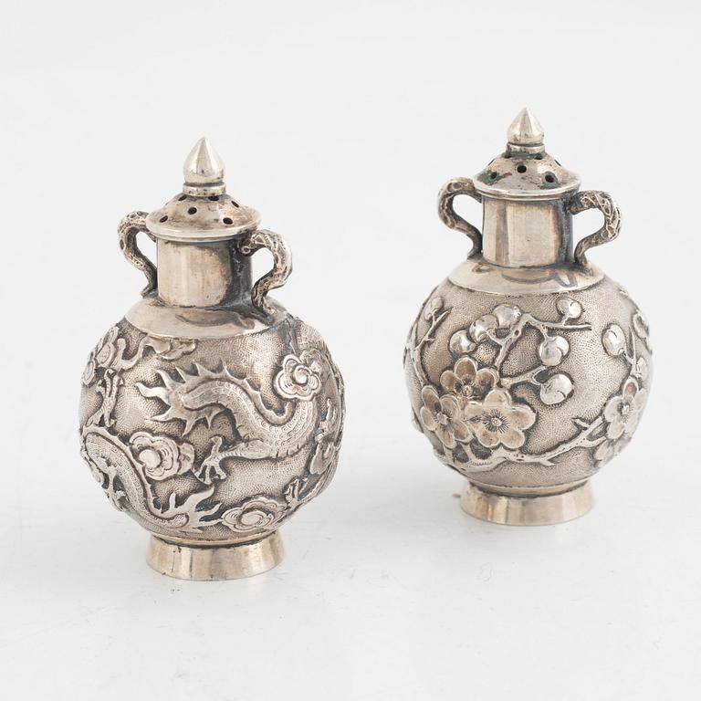 A pair of Chinese silver shakers, late Qing dynasty.