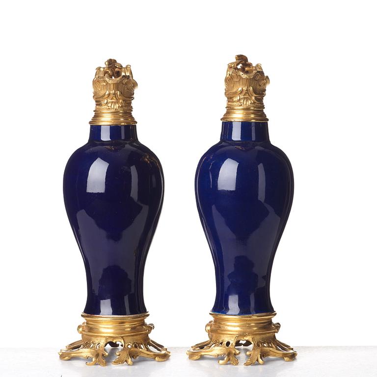 A pair of gilt bronze mounted vases, Qing dynasty, Qianlong (1736-95). French bronze mounts.