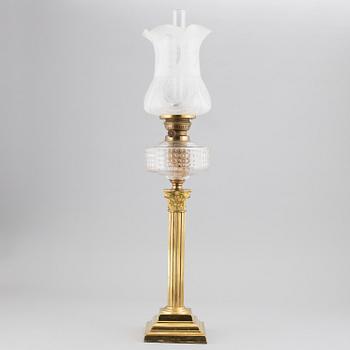 A brass oil lamp, ca 1900.