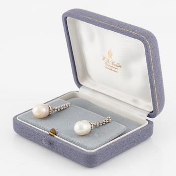 A pair of earrings in 18K white gold with cultured South Sea pearls and round brilliant-cut diamonds.