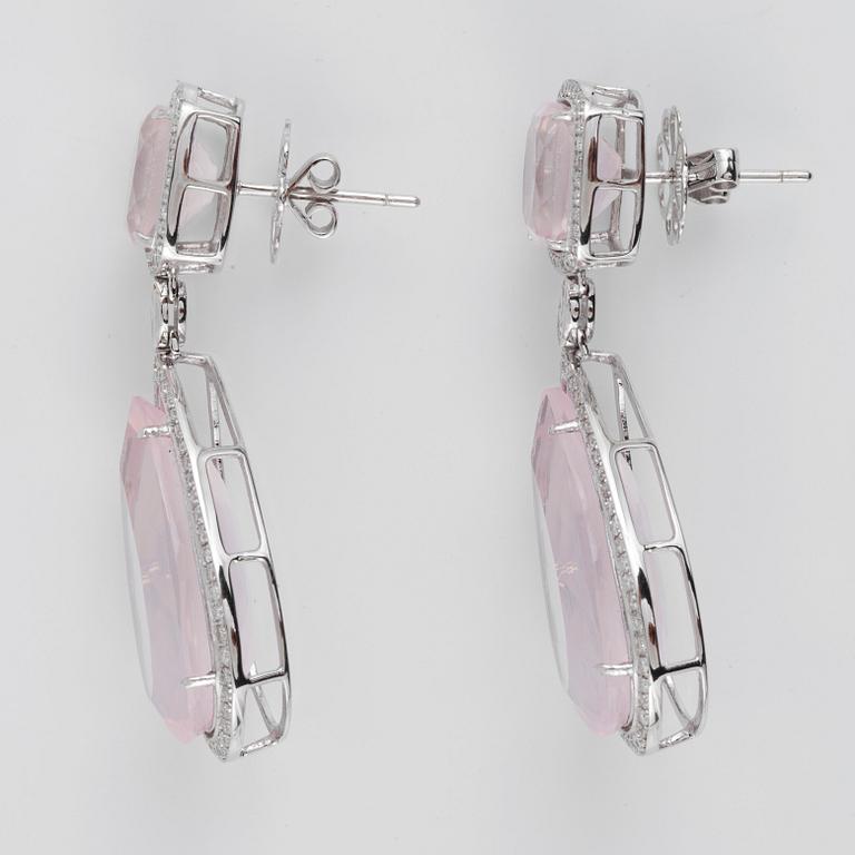 A pair of rose quartz, circa 34.00 ct, and diamond, circa 1.32 ct, earrings.