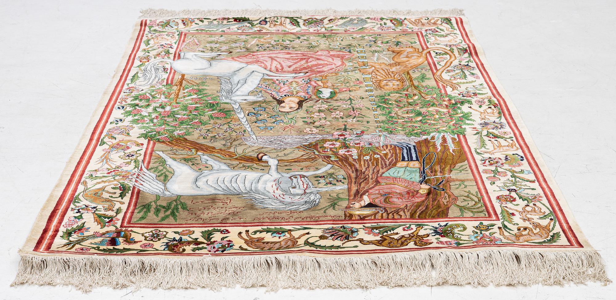 A silk Qum rug, central Persia, c. 213 x 135 cm.