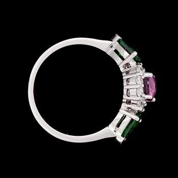 A pink sapphire, tsavorite and diamond ring.