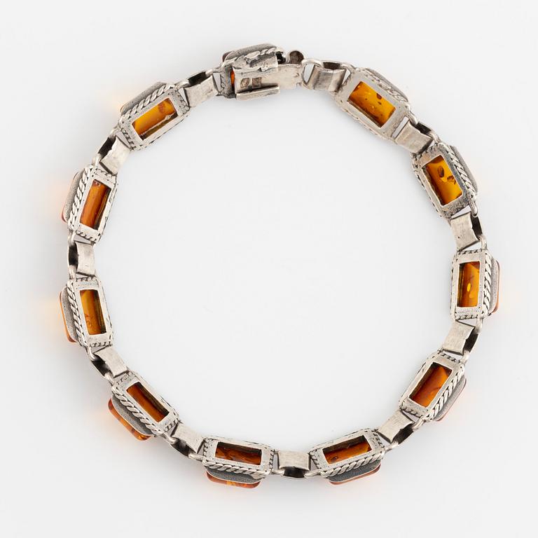 Silver and amber bracelet and earrings.