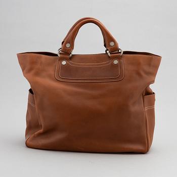 Céline, a leather handbag.